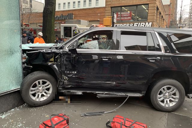 Photograph showing SUV crashed into building